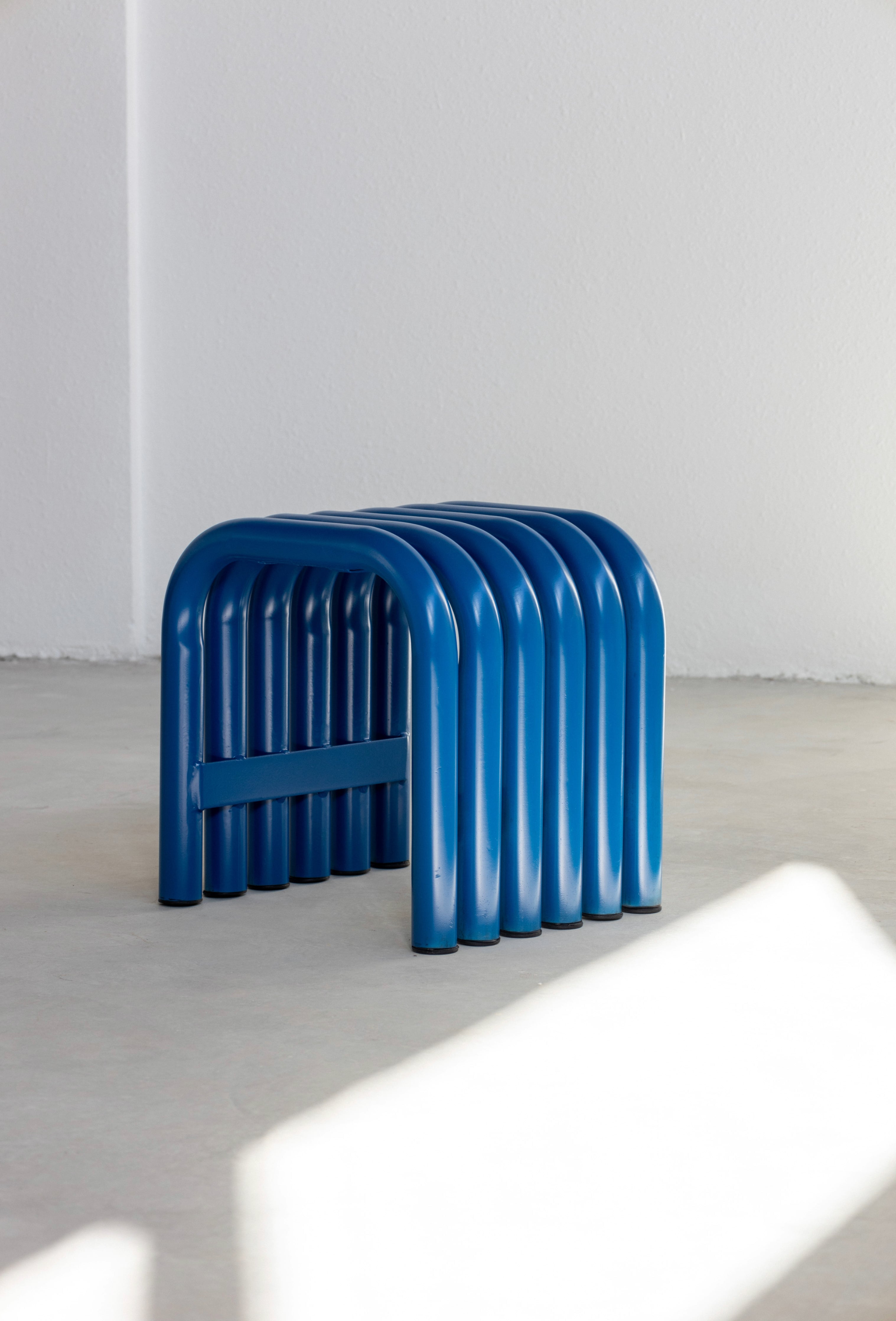 Blue steel Nokk stool for indoor or outdoor seating