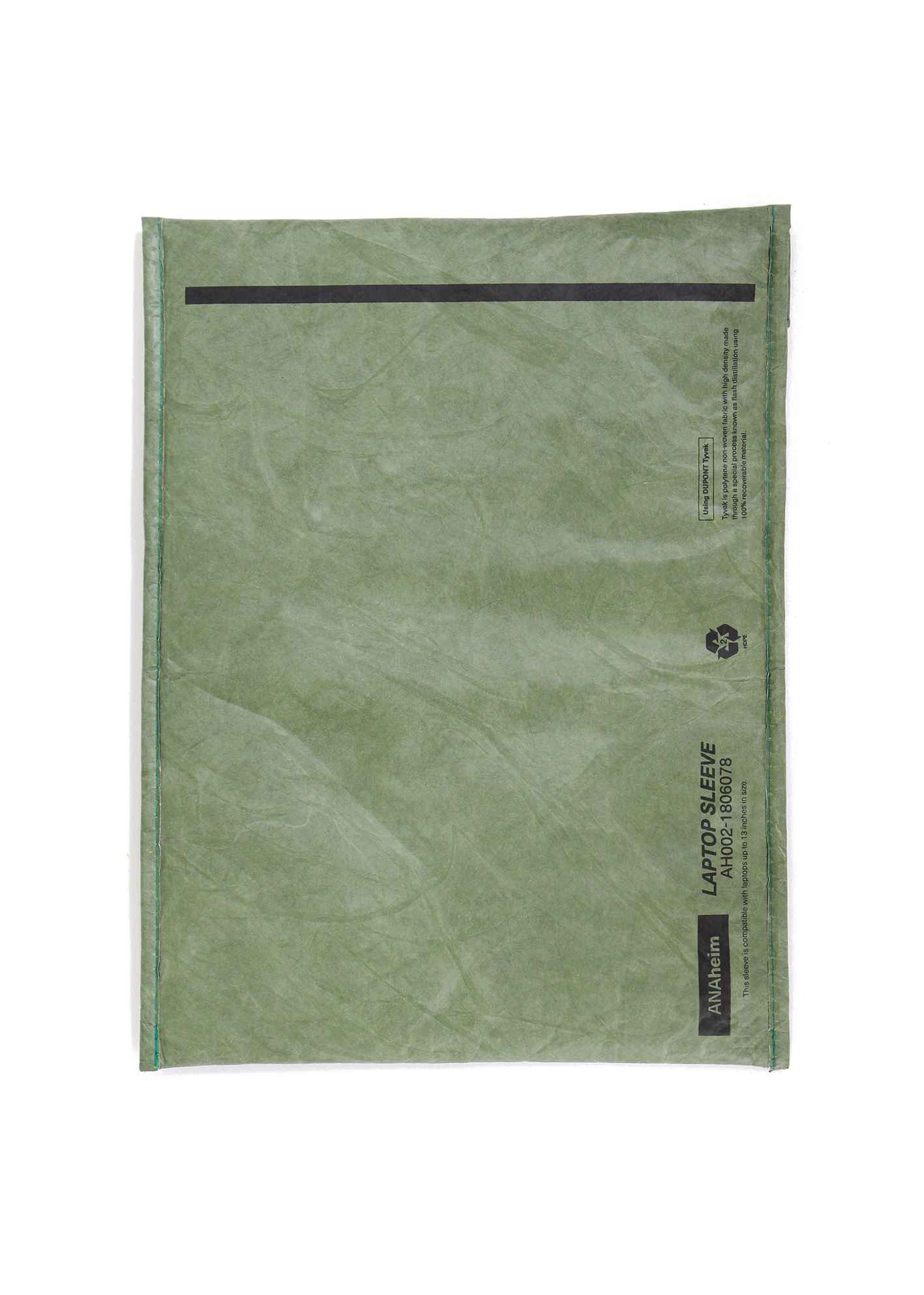 Green fabric envelope with black label on a white background