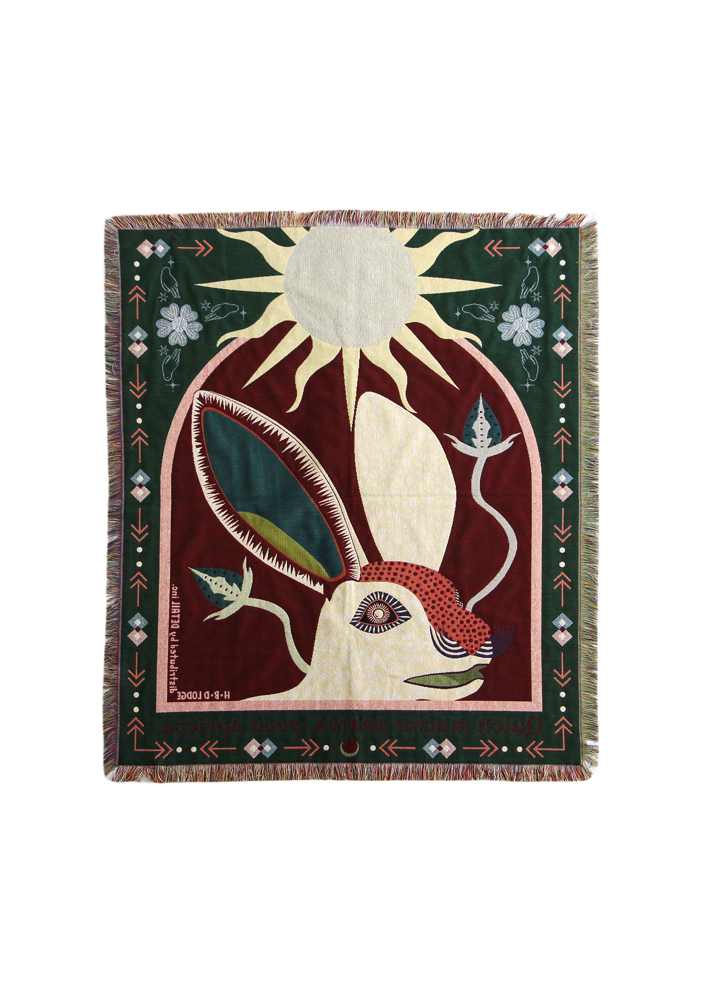 Decorative blanket with a rabbit and sun design on a white background