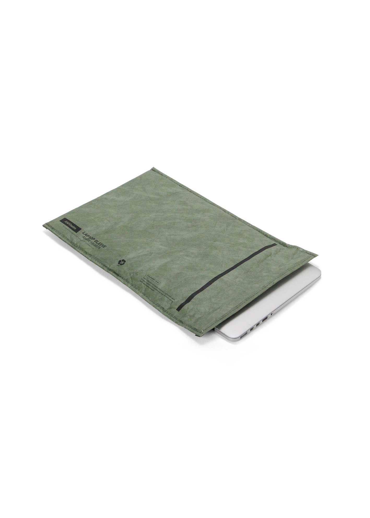 Green fabric garment bag covering a white laptop on a white background