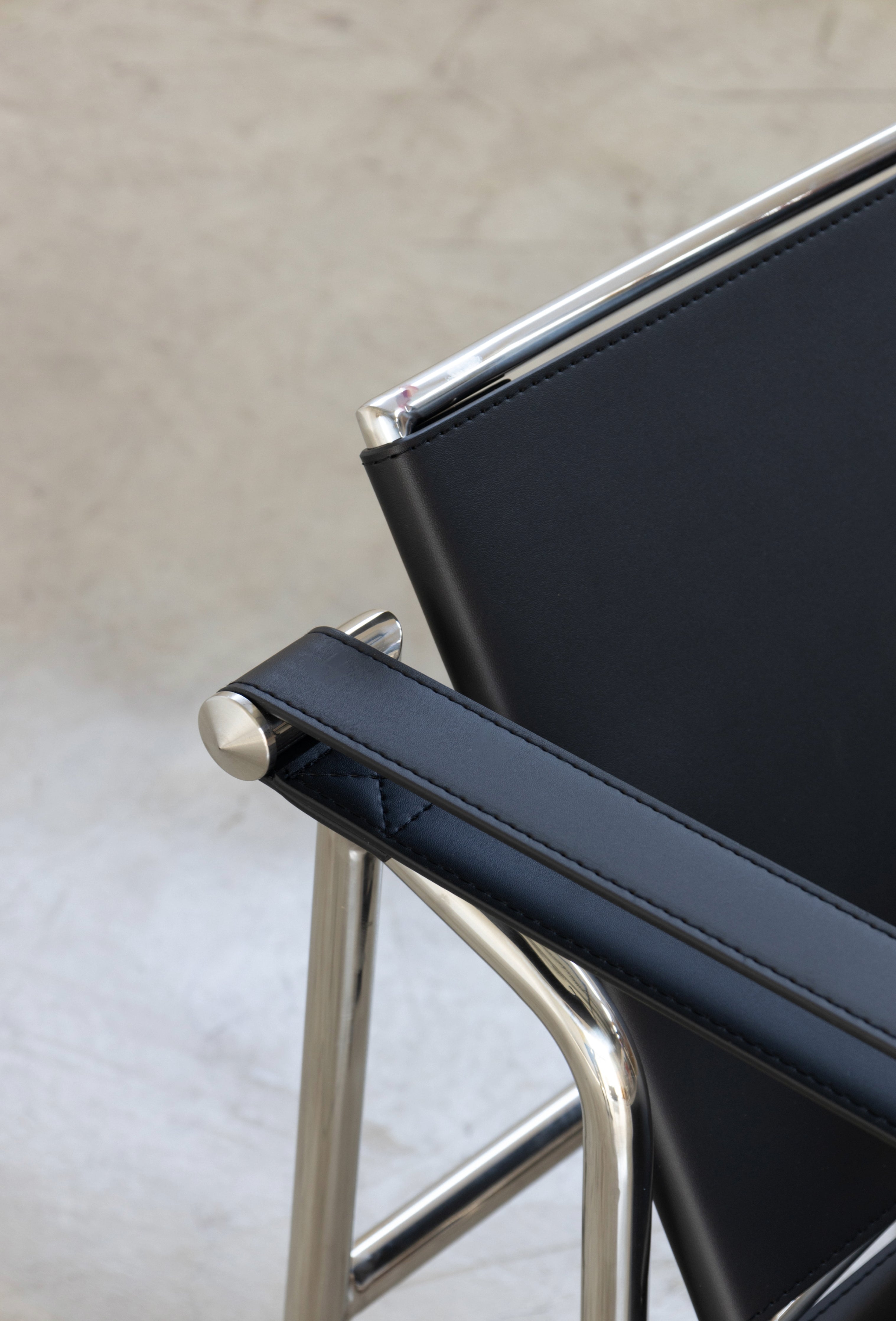 Explore the Basculant Chair by Le Corbusier, first exhibited in 1929. This stylish, vintage design combines timeless elegance with exceptional comfort.