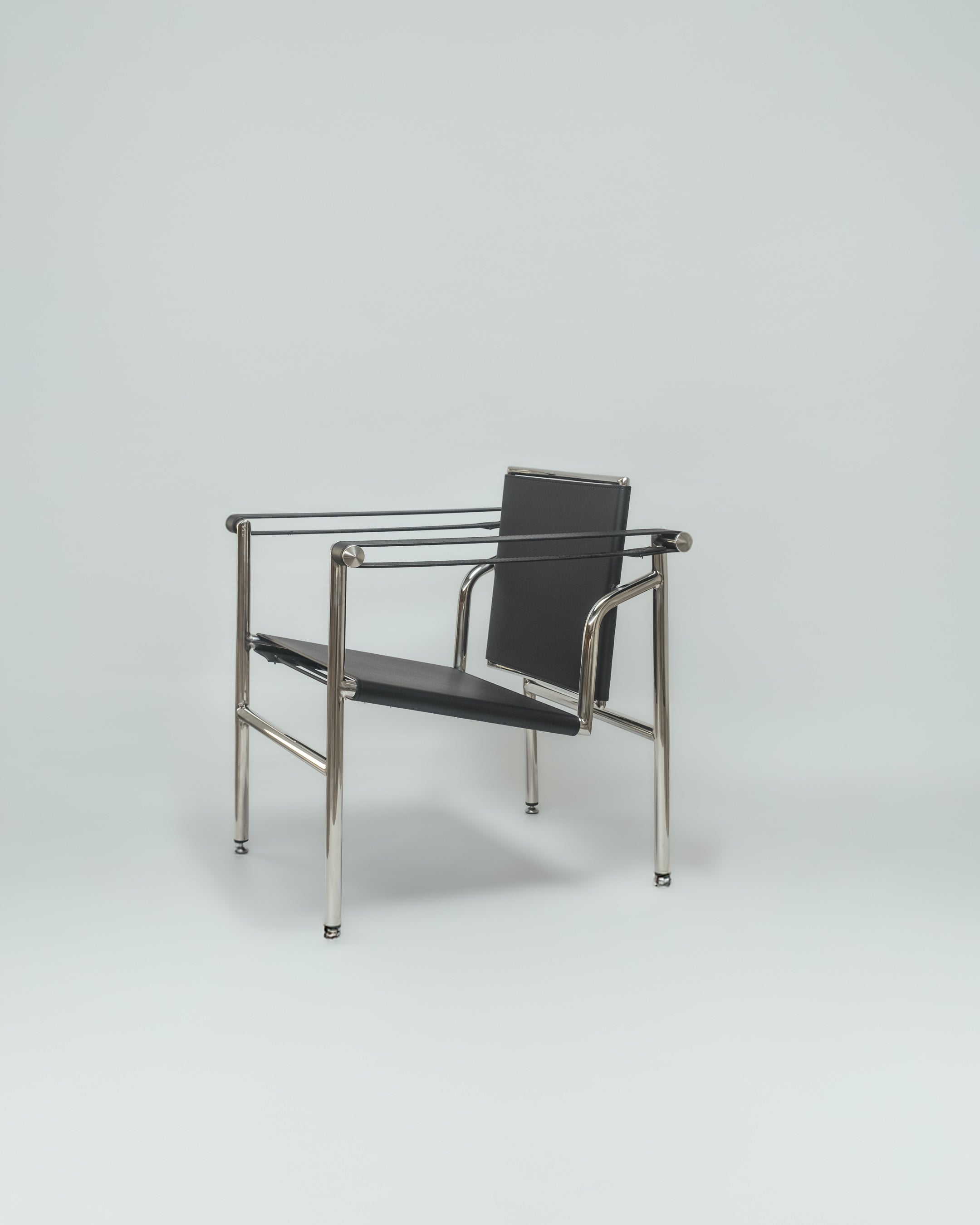 Explore the Basculant Chair by Le Corbusier, first exhibited in 1929. This stylish, vintage design combines timeless elegance with exceptional comfort.