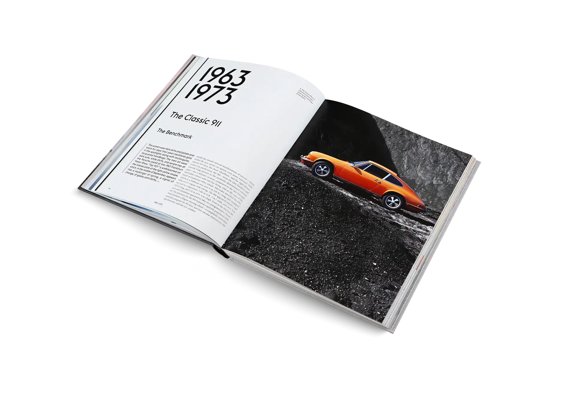 Open book showing a photograph of an orange car on a white background