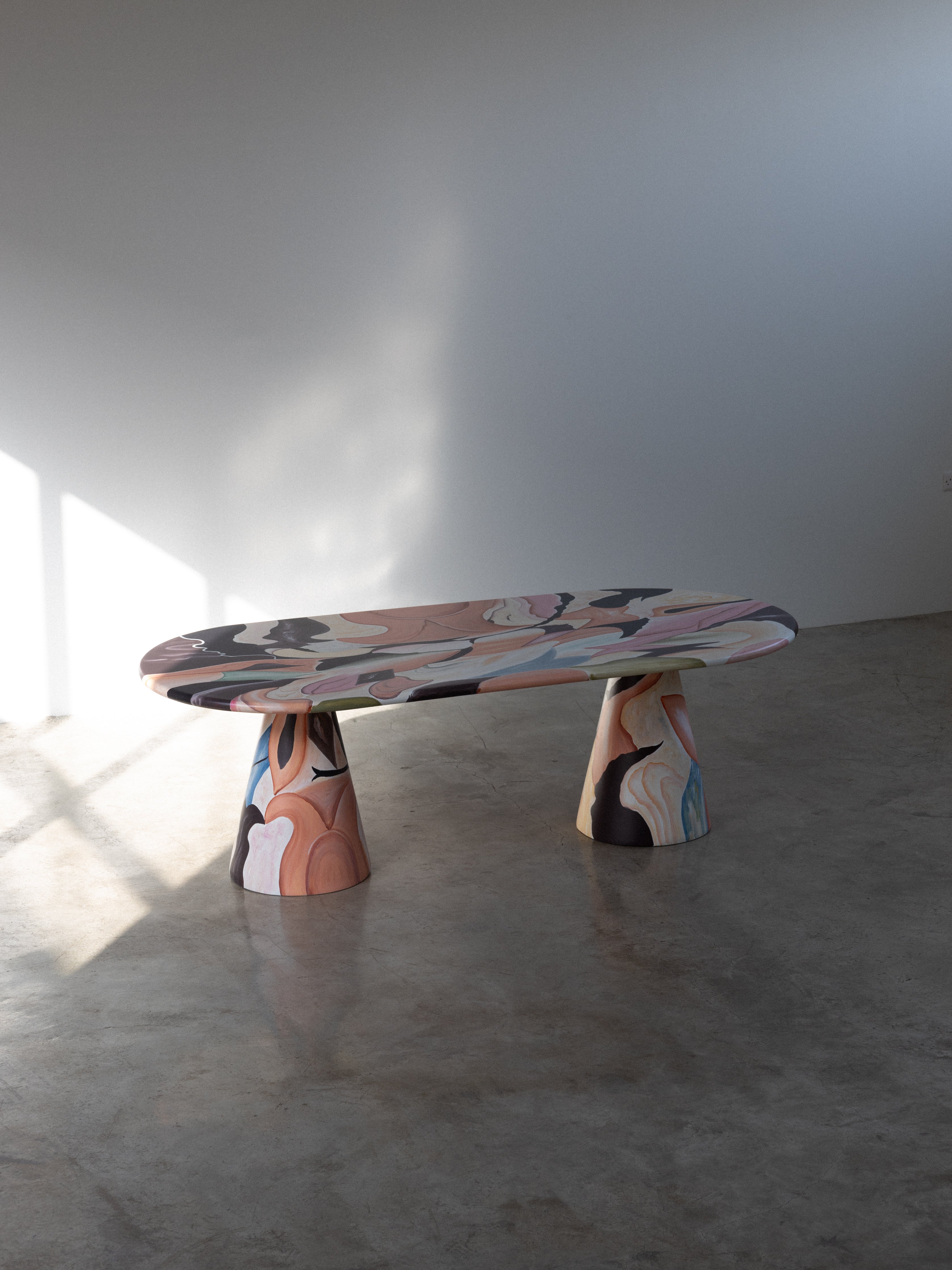 Meltingpot Dining Table – Modern dining table with a sleek, minimalist design, featuring a solid wood top and sturdy metal base, ideal for contemporary interiors.