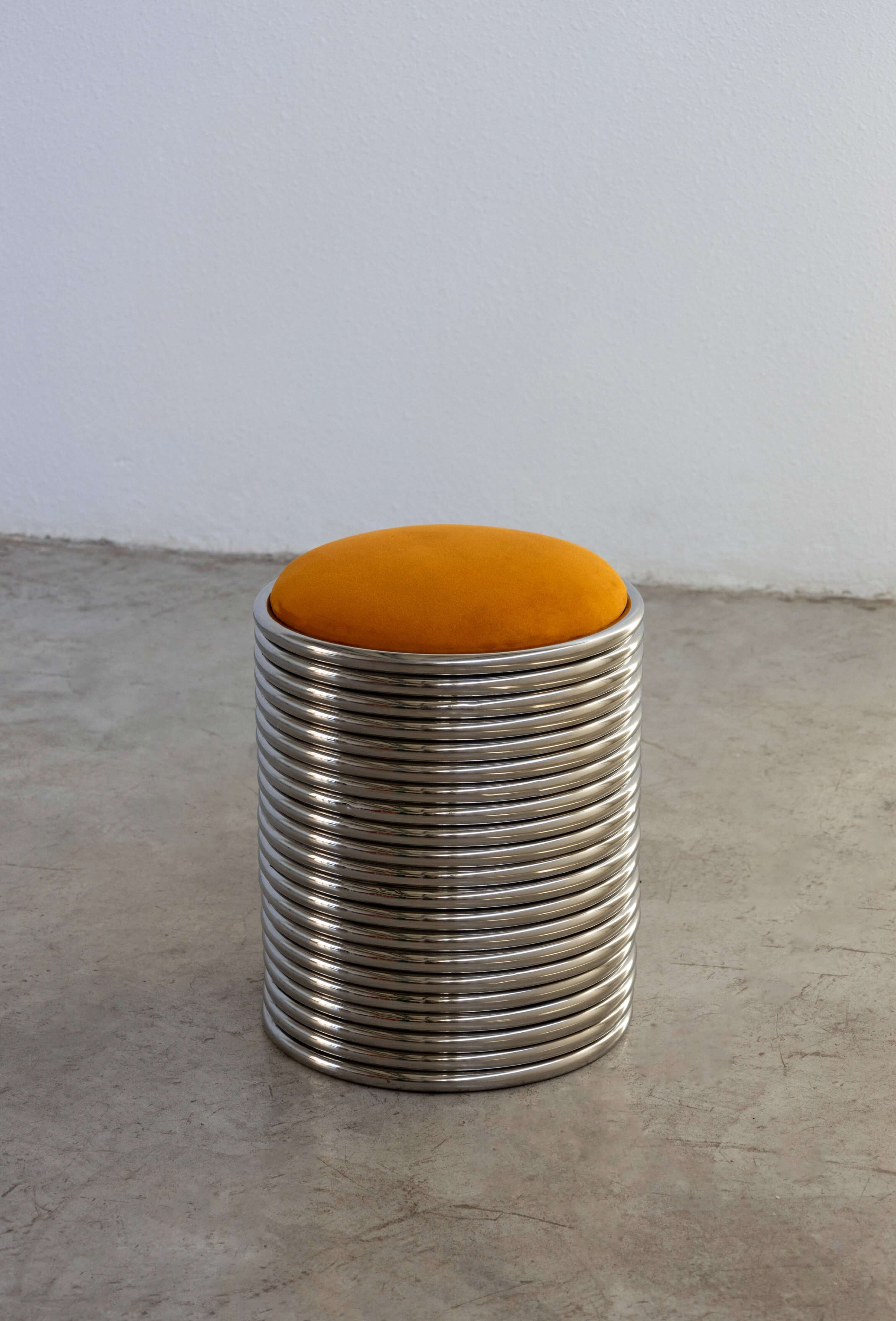 Contemporary orange Rings Stool – Sleek cylindrical stainless-steel stool, 40 cm high and 34 cm in diameter, ideal for modern living spaces.