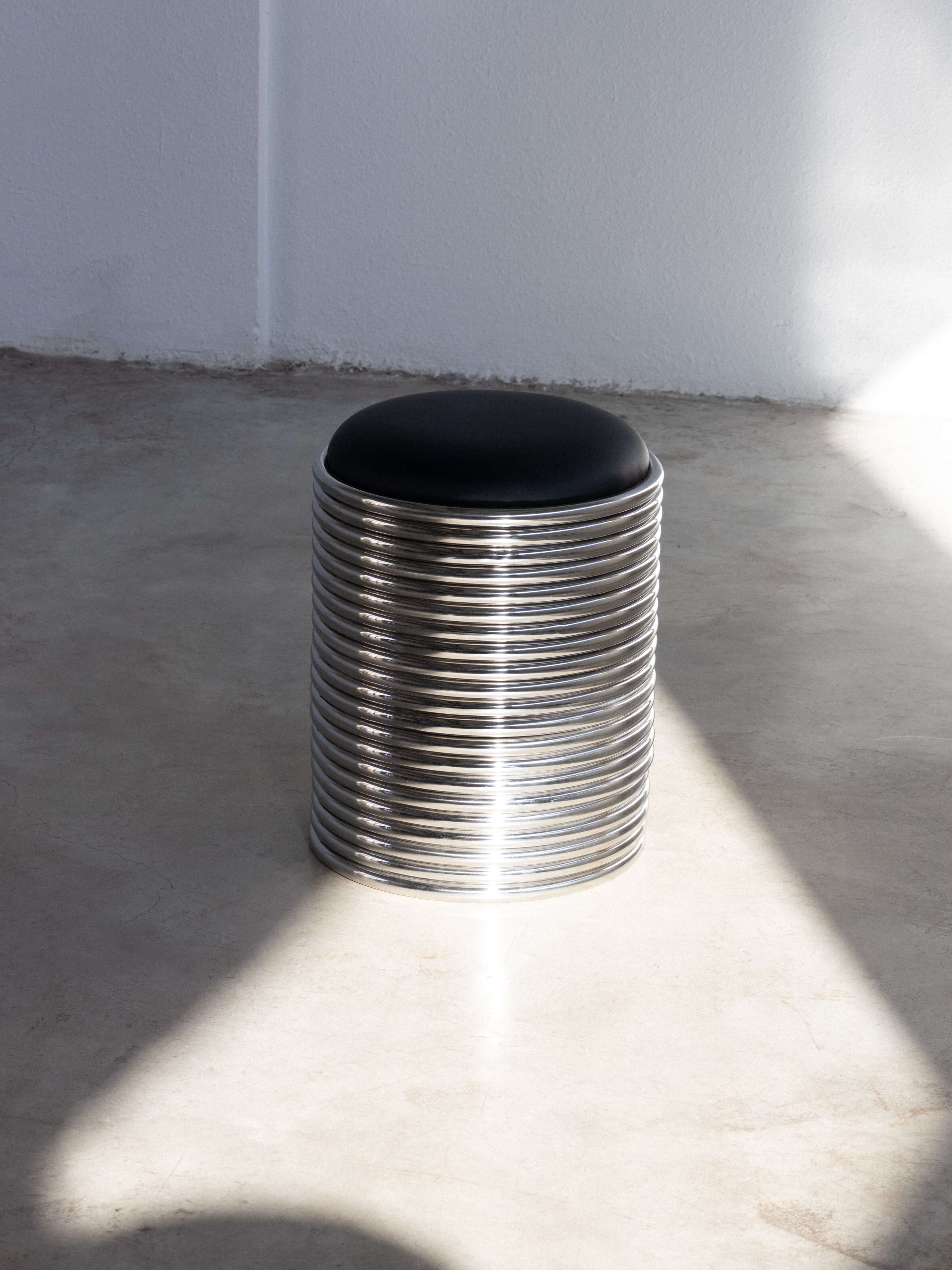 Rings Stool in black with a sleek metal design, ready for delivery within 40 days, perfect for modern interiors.